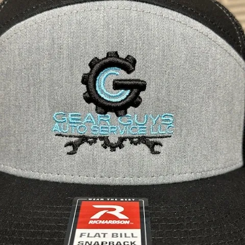 Flat bill snapback with Gear Guys Auto Service embroidered gear logo